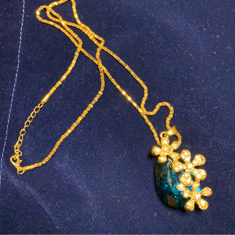 Fashion chain and blue pendant.